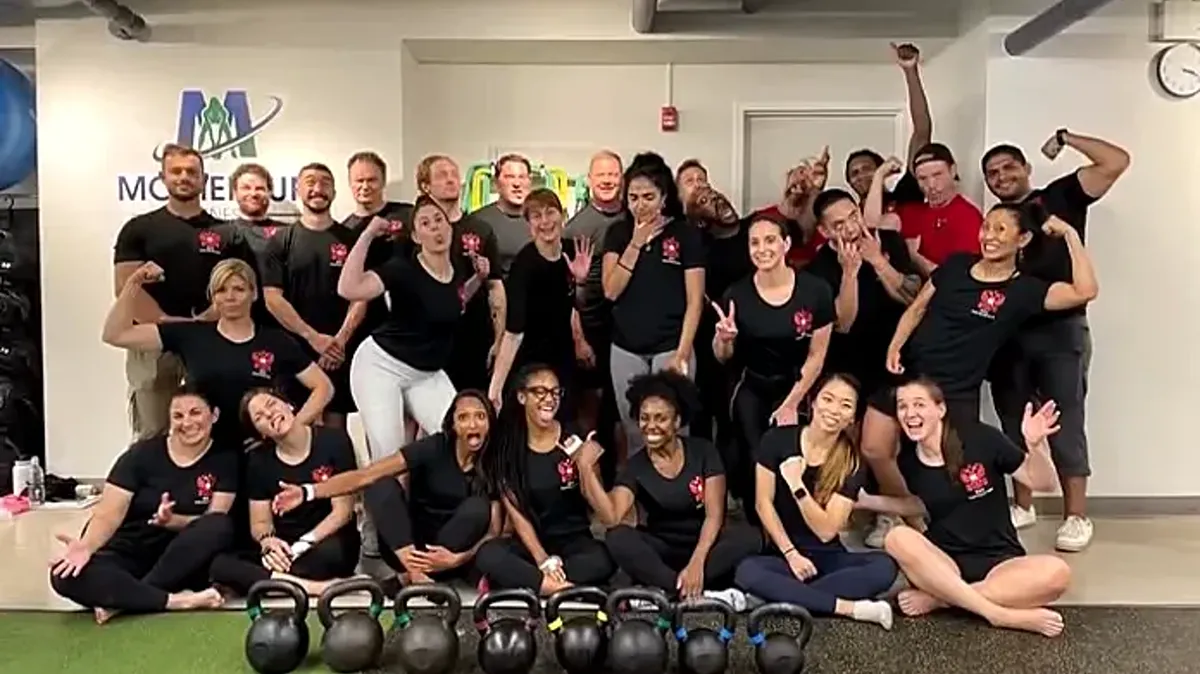 RKC kettlebell certification group photo at Momentum Fitness NYC on the Upper West Side, newly certified instructors with kettlebells