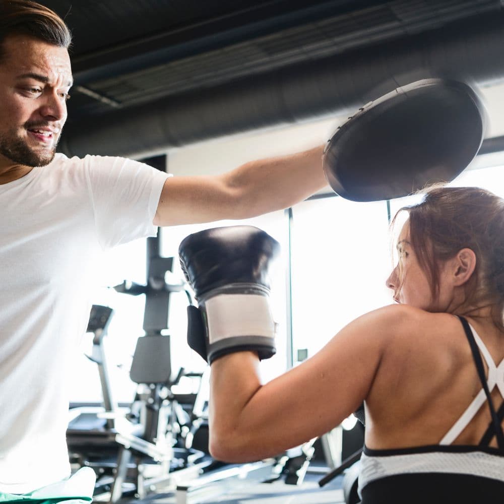 Boxing pad work training session with a certified boxing trainer at Momentum Fitness on the Upper West Side
