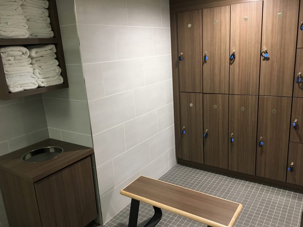 Locker room with complimentary towels, keyed day-use lockers, and bench seating